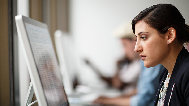 woman working on her system in the office