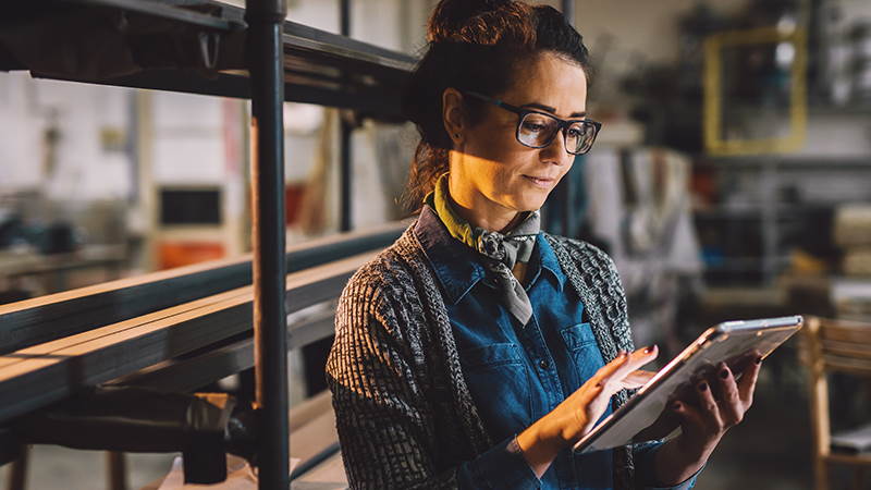 Woman checking tablet