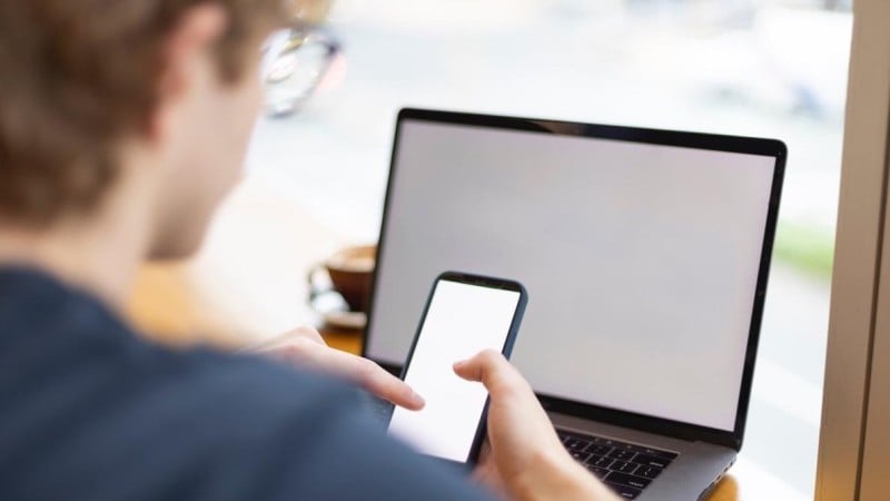 Man on phone and laptop